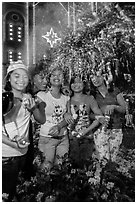 Young Revellers in front of Notre Dame Cathedral on Christmas Eve. Ho Chi Minh City, Vietnam (black and white)