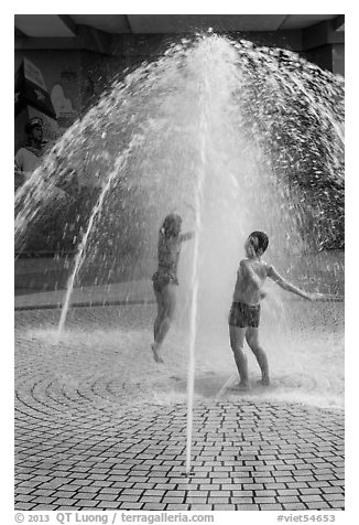 Children in fountain, Dam Sen Water Park, district 11. Ho Chi Minh City, Vietnam (black and white)