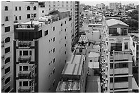 Rooftop view of skinny hotel buildings. Ho Chi Minh City, Vietnam (black and white)