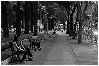 Park sidewalk at dusk. Ho Chi Minh City, Vietnam ( black and white)