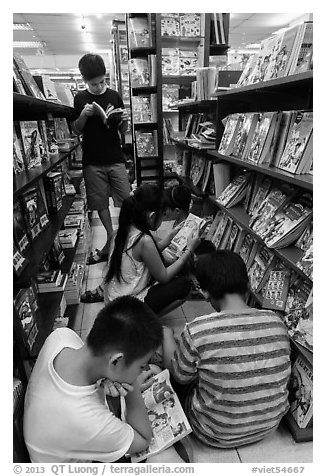 Children reading in bookstore. Ho Chi Minh City, Vietnam (black and white)