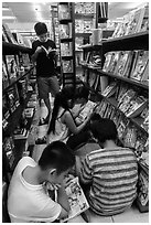 Children reading in bookstore. Ho Chi Minh City, Vietnam (black and white)