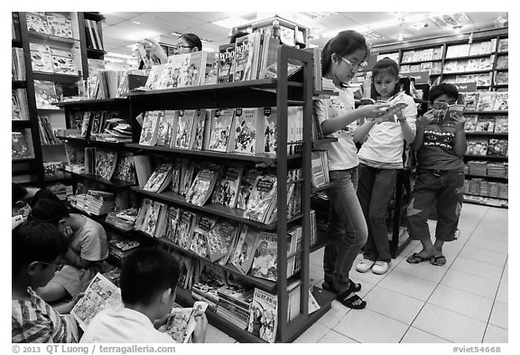 Bookstore shelves and children reading. Ho Chi Minh City, Vietnam (black and white)