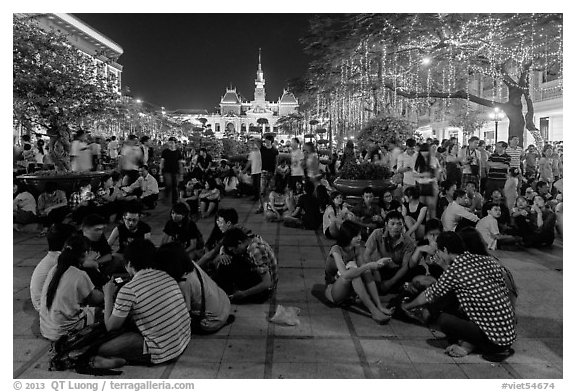 Groups in front of City Hall on New Year eve. Ho Chi Minh City, Vietnam (black and white)