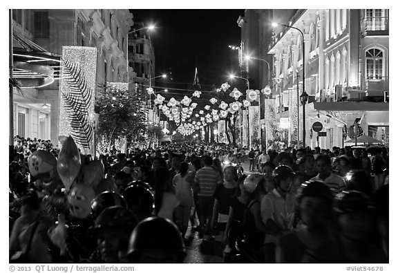 Packed street at night, New Year eve. Ho Chi Minh City, Vietnam (black and white)