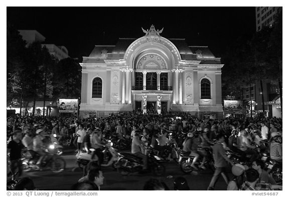 Crowds in front of Opera House at night. Ho Chi Minh City, Vietnam