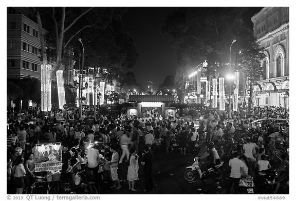 Le Loi boulevard crowds on New Year eve. Ho Chi Minh City, Vietnam (black and white)