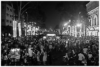 Le Loi boulevard crowds on New Year eve. Ho Chi Minh City, Vietnam ( black and white)