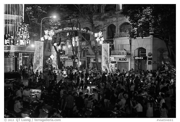 Crowds on street at night, New Year eve. Ho Chi Minh City, Vietnam (black and white)