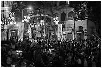 Crowds on street at night, New Year eve. Ho Chi Minh City, Vietnam ( black and white)