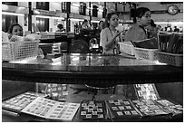 Stamp vending booth in central post office. Ho Chi Minh City, Vietnam ( black and white)