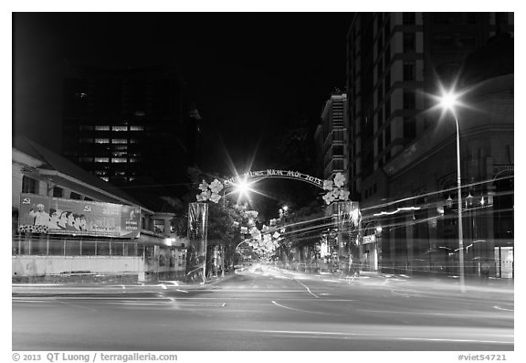 Dong Khoi street at night with light trails and decorations. Ho Chi Minh City, Vietnam (black and white)