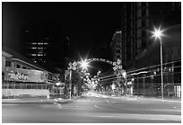 Dong Khoi street at night with light trails and decorations. Ho Chi Minh City, Vietnam (black and white)