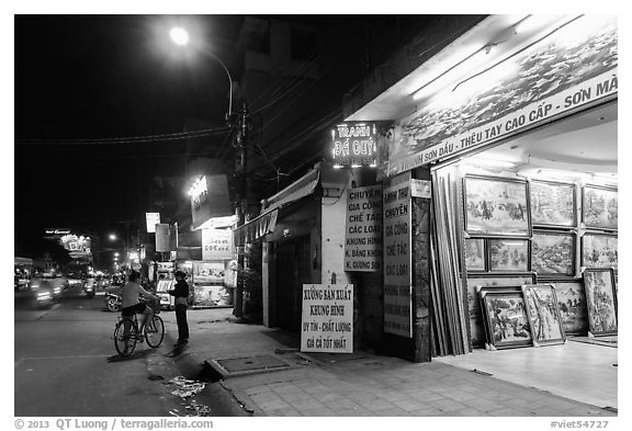 Stores selling pictures at night. Ho Chi Minh City, Vietnam