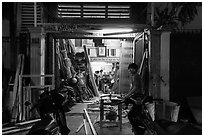 Frame shop at night. Ho Chi Minh City, Vietnam (black and white)