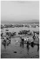 Miror-like beach and fishing boats, early morning. Mui Ne, Vietnam (black and white)