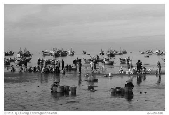 Fishermen, vendors, and boats. Mui Ne, Vietnam (black and white)