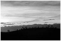 Tourists on dune ridge at sunset. Mui Ne, Vietnam ( black and white)