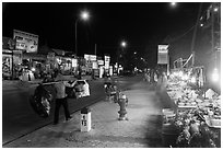 Stalls on main street at night. Mui Ne, Vietnam (black and white)