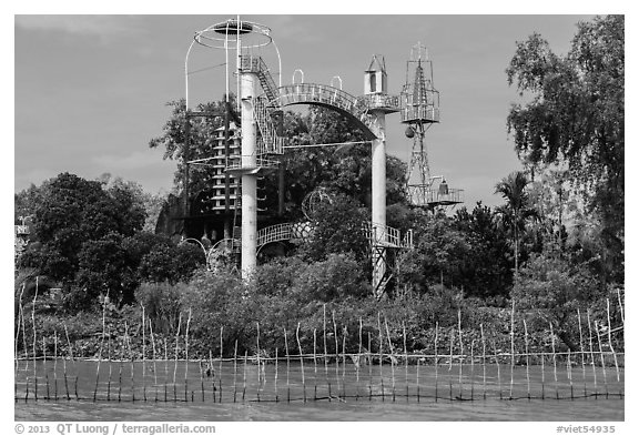 Coconut monk temple seen from water, Phoenix Island. My Tho, Vietnam (black and white)