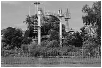 Coconut monk temple seen from water, Phoenix Island. My Tho, Vietnam (black and white)