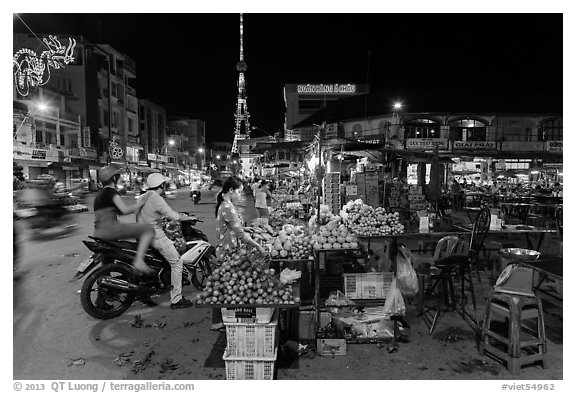 Street market and telecomunication tower at night. Tra Vinh, Vietnam