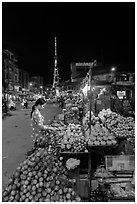 Fruit vendor on main street at night. Tra Vinh, Vietnam (black and white)