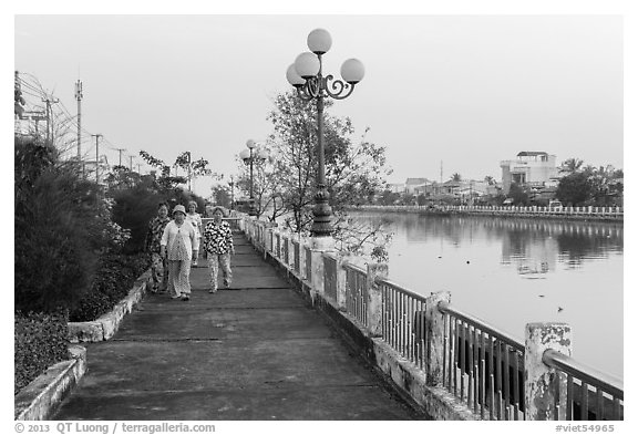 Elderly women strolling on riverfront. Tra Vinh, Vietnam