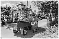 Funeral vehicle and attendants. Tra Vinh, Vietnam (black and white)