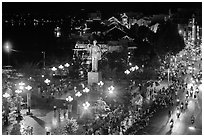 Mekong River, Ho Chi Minh statue, and street at night. Can Tho, Vietnam (black and white)