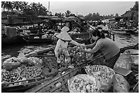 Fruit being sold from boat to boat, Phung Diem floating market. Can Tho, Vietnam ( black and white)