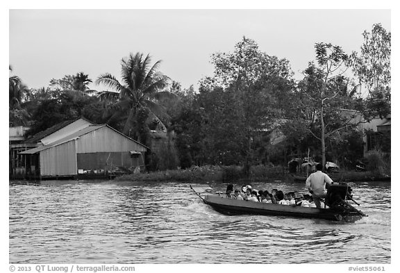 Schoolchildren on boat commute. Can Tho, Vietnam (black and white)