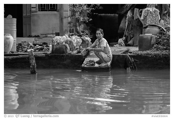 Woman laudering at the river. Can Tho, Vietnam