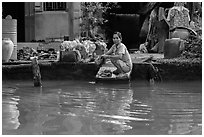 Woman laudering at the river. Can Tho, Vietnam ( black and white)