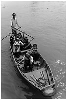 Schoolchildren rowed by parent. Can Tho, Vietnam (black and white)
