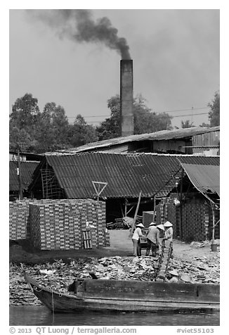 Workers moving bricks in brick factory. Sa Dec, Vietnam