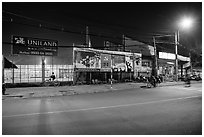 Street and stadium at night, District 8. Ho Chi Minh City, Vietnam ( black and white)