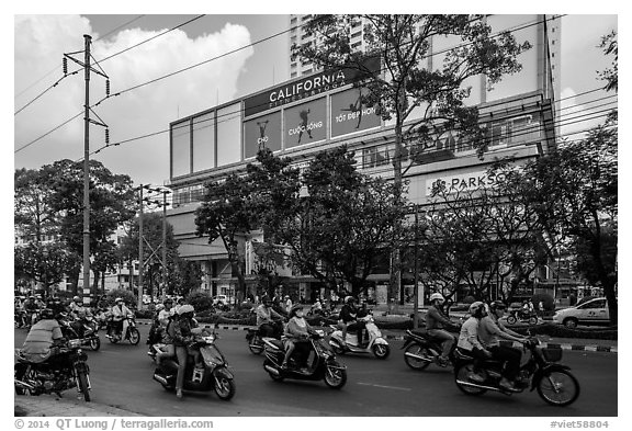 Motorcycle traffic and Hung Vuong Plaza mall. Cholon, Ho Chi Minh City, Vietnam (black and white)