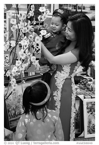 Woman and children in traditional dress for lunar new year. Ho Chi Minh City, Vietnam (black and white)