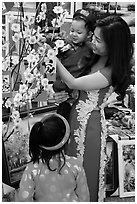 Woman and children in traditional dress for lunar new year. Ho Chi Minh City, Vietnam ( black and white)