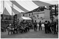 Uniformed young men and women gather for lunar new year. Ho Chi Minh City, Vietnam ( black and white)