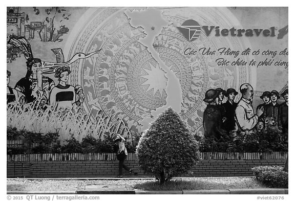 Lottery ticket child seller walking on sidewalk. Ho Chi Minh City, Vietnam (black and white)