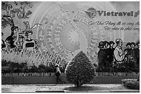 Lottery ticket child seller walking on sidewalk. Ho Chi Minh City, Vietnam ( black and white)