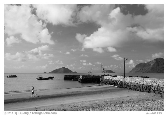 Beach with woman exercising, Con Son. Con Dao Islands, Vietnam (black and white)