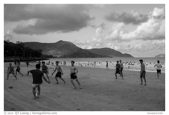 Men play soccer on beach, Con Son. Con Dao Islands, Vietnam (black and white)