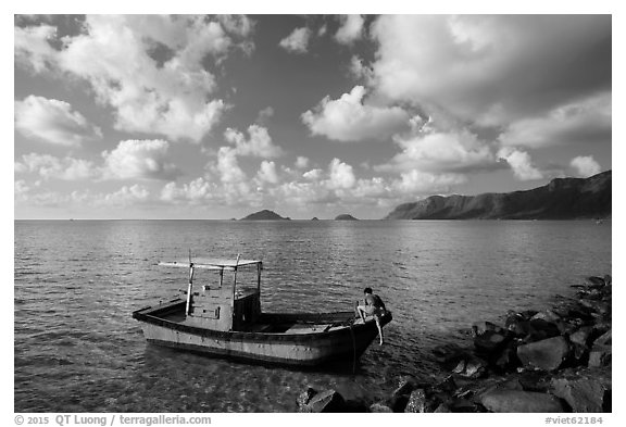 Fisherman climbing on boat, Con Son. Con Dao Islands, Vietnam (black and white)