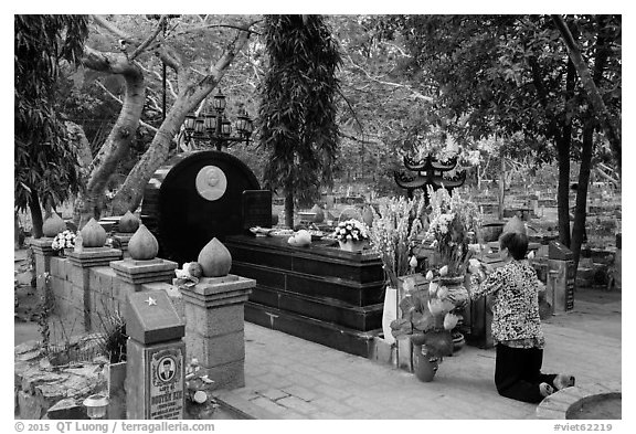 Woman pays respect to Vo Thi Sau grave. Con Dao Islands, Vietnam (black and white)