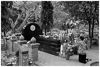 Woman pays respect to Vo Thi Sau grave. Con Dao Islands, Vietnam ( black and white)