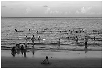 Beachgoers at sunset, Con Son. Con Dao Islands, Vietnam ( black and white)