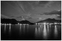 Lights of Con Son reflected in harbor at dawn. Con Dao Islands, Vietnam ( black and white)